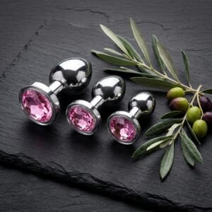 Three pink gem anal plugs displayed.